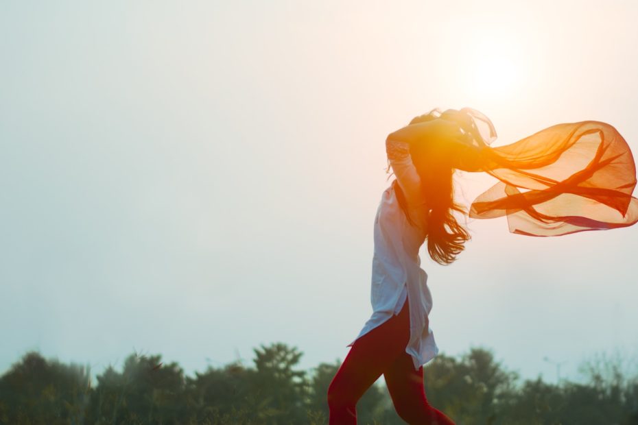 woman spreading hair at during sunset